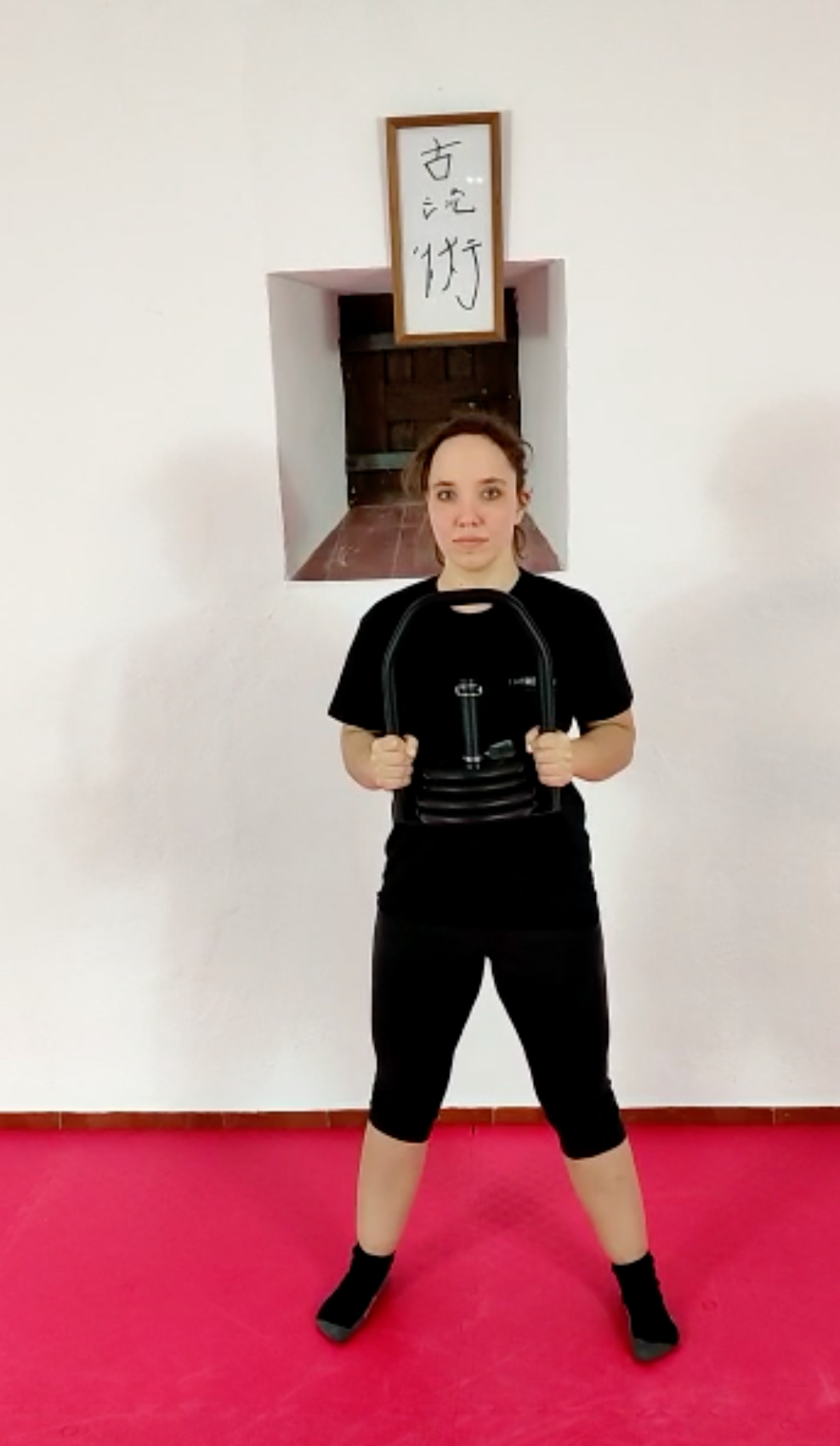 Goblet hold position with Regulabell kettlebell